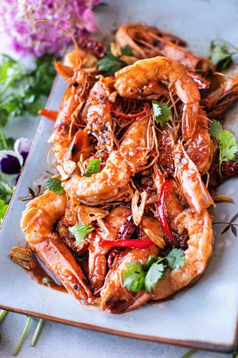 This Tiger shrimp (Prawns) with Thai tamarind sauce is a delightful combination of tangy, sweet, and savory flavors. Large tiger prawns are used for their meatiness. Cooked to perfection in the sweet and spicy tamarind sauce, creating a perfect balance of memorable flavors that will keep you coming back for more!  #tamarindshrimp #thaitamarindshrimp #shrimpintamarindsauce #thaishrimp #tamarindshrimprecipe #shrimpintamarindpaste #thaitamarindshrimprecipes Tamarind Shrimp Recipes, Tamarind Shrimp, Thai Recipes Authentic, Tiger Prawns, Tiger Shrimp, Thai Shrimp, Pad Thai Sauce, Tamarind Sauce, Prawn Shrimp