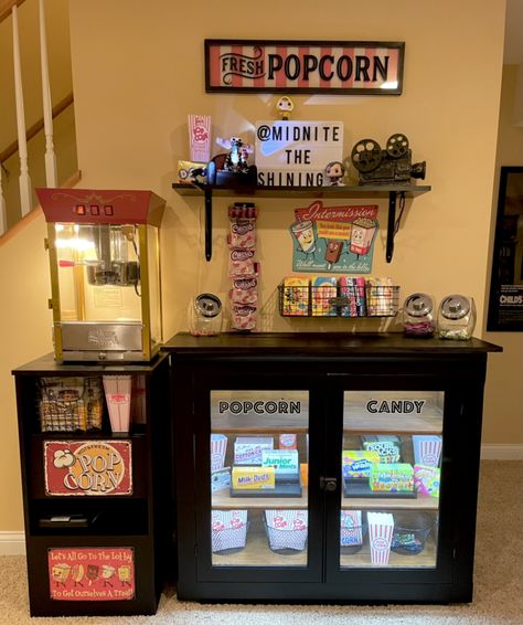 Basement Bar With Popcorn Machine, Cool Basement Decor, Popcorn Machine In Home Decor, Popcorn Station Home, Movie Theater Living Room, Popcorn Stand Ideas, Home Theater Snack Bar Ideas, Basement Snack Bar Ideas, Movie Room Snack Bar