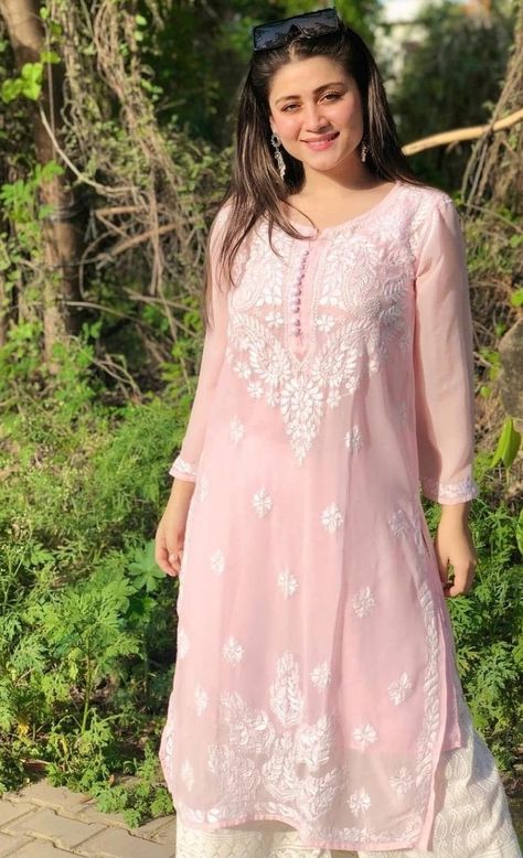 Girl wearing light pink kurti with embroidery Embroidered Outfits, Indowestern Kurti, Palazzo Kurti, Kurti With Jeans, Casual Kurtis, Pink Kurti, Kurti Styles, Casual Kurti, Embroidery Kurti