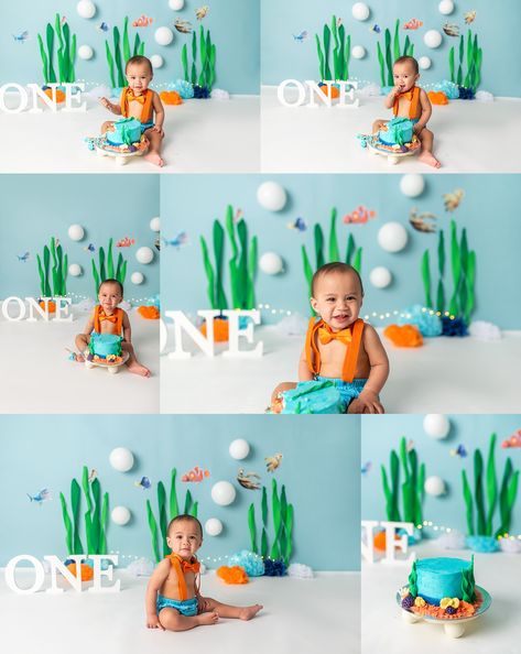 1 year old boy eating cake in front of a blue finding nemo background Finding Nemo Birthday Photoshoot, Ocean Themed Smash Cake, Ocean Smash Cake, Finding Nemo First Birthday, Nemo Smash Cake, Finding Nemo Cake Smash, Finding Nemo Smash Cake, Finding Nemo Theme, Finding Nemo Cake