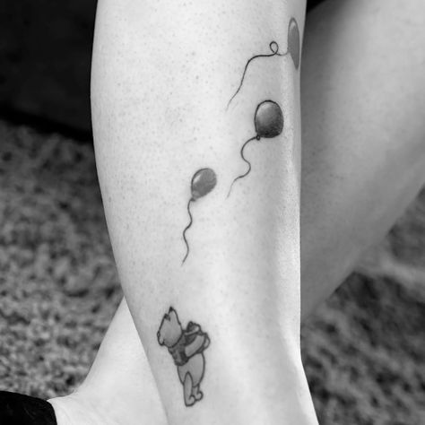 ‘Winnie the Pooh’ tattoo, artist unknown. (Photo via Synthesis Weekly.) #minimalist #winniethepooh #pooh #poohbear #nostalgia #children #tvshow #cartoon #book #balloon Grandkids Tattoos, Pooh Tattoo Ideas, Winnie The Pooh Tattoo Ideas, Balloons Tattoo, Eeyore Tattoo, Winnie The Pooh Tattoo, Pooh Tattoo, Grandma Tattoo, Winnie The Pooh Tattoos