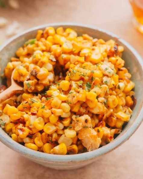 A bowl of Mexican Street Corn Salad (Esquites) garnished with fresh cilantro. Recipes Using Cotija Cheese, Fish Tacos Sides Dishes, Sides For Fish Tacos, Mexico Corn, Cob Salad, Mexican Street Corn Salad Recipe, Corn Off The Cob, Taco Side Dishes, Street Corn Salad