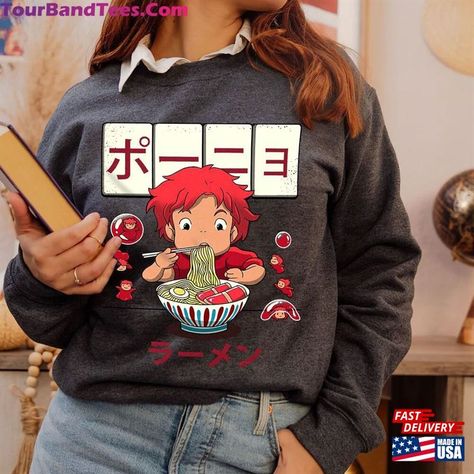 Cute Ponyo Eat Ramen Shirt On The Cliff Goldfish Studio Ghibli Merch Hoodie Classic Check more at https://tourbandtees.com/product/cute-ponyo-eat-ramen-shirt-on-the-cliff-goldfish-studio-ghibli-merch-hoodie-classic/ Studio Ghibli Merch, Cliff By The Sea, Ghibli Merch, Ramen Shirt, Merch Hoodie, The Cliff, Japanese Cartoon, Japanese Animation, American Comics