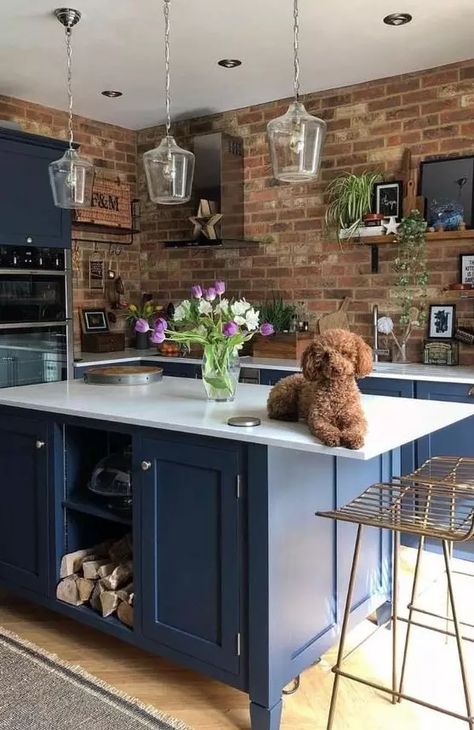 a bright blue kitchen with white countertops and glass pendant lamps is made bolder with red brick walls Navy Cabinets, Kitchen Renovation Design, Navy Kitchen, Small Kitchen Tables, Kitchen Design Diy, Brick Backsplash, Beautiful Home Designs, Renovation Design, 아파트 인테리어