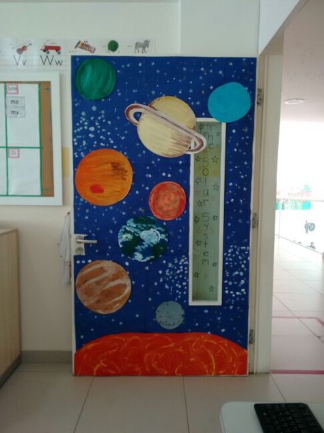 Solar system. Classroom door. Classroom Solar System Decoration, Planet Door Decorations Classroom, Solar System Door Decorations Classroom, Space Classroom Door Ideas, Moon Classroom Decor, Out Of This World Classroom Door, Solar System Bulletin Board Ideas, Nasa Classroom Theme, Space Theme Door Decorations