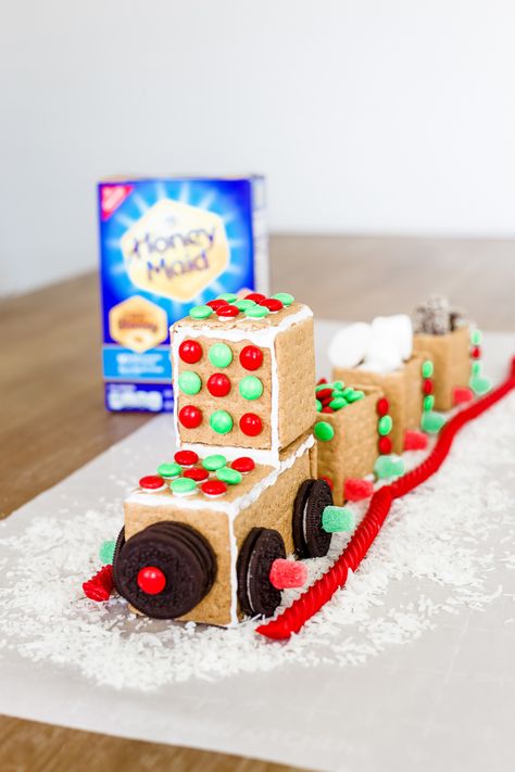 The Holiday Express Candy Train made out of @honeymaid Graham Crackers. Grab yours @walmart and start creating memories! @honeymaidsnacks #Ad #HoneyMaidHouses Graham Cracker Train, Gingerbread House With Graham Crackers, Holiday Baking Party, Candy Train, Cracker House, Polar Express Party, Gingerbread Train, Loving Others, Christmas Candy Gifts