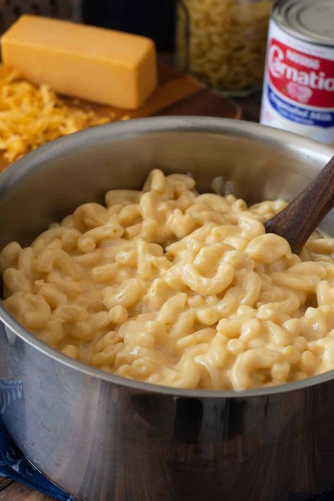 All you need is 3 ingredients to make this decadent and creamy stovetop mac n cheese. The evaporated milk is key to that classic creamy texture and rich flavor. #macaroniandcheese #macncheese #evaporatedmilk #easyrecipes  via @thecookful Mac N Cheese With Evaporated Milk, Mac And Cheese Recipe Evaporated Milk, Stovetop Mac N Cheese, Old Fashioned Mac And Cheese Recipe, Mac N Cheese Velveeta, Crockpot Mac N Cheese Recipe, Evaporated Milk Recipes, Taco Mac And Cheese, Crockpot Mac And Cheese