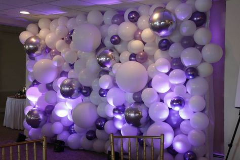 Balloon Sculptures - Organic Balloon Wall Backdrop with Purple & Silver Balloons & LED Uplighting for Bat Mitzvah at the Davenport Club - party decor inspiration - Entering the ballroom, our light up, colorful balloon sculptures are guaranteed to enliven your guest’s eyes. They are designed to create a unique experience for your party guests. Purple Party Backdrops, Purple And Silver Birthday Party Decor, Club Party Decorations, Purple Decorations Party, Balloon Wall Backdrop, Led Uplighting, Deco Violet, Balloon Walls, Purple Party Decorations