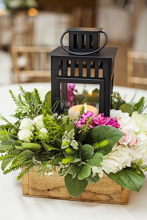 Black Lantern Centerpiece With Fresh Greenery Black Lantern Centerpiece, Outdoor Wedding Centerpieces, Lantern Centerpiece Wedding, Greenery Centerpiece, Romantic Outdoor Wedding, Lantern Centerpieces, Wedding Lanterns, Centerpiece Ideas, Wedding Arrangements