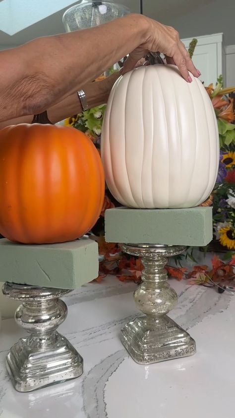 fall decor hack using candlesticks!🎃 | interior design | fall decor hack using candlesticks!🎃 Get creative with your candlesticks and make them a eye catching centerpiece for your fall decor. | By Janelle & Kate Diy Fall Floral Decor, Decorating With Candlesticks Ideas, Candlestick Pumpkin Decor, Pumpkin Pedestal, Halloween Candlesticks Diy, Yardstick Fall Centerpiece, Pumpkins On Candlesticks, Fall Candlestick Arrangements, Fall Candlestick Decor