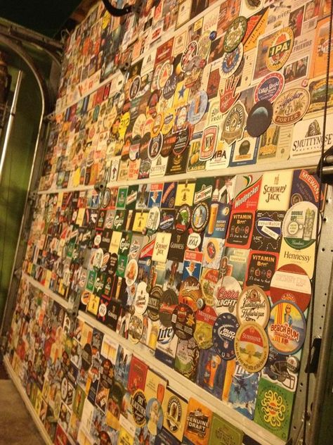 Over 600 coasters make up the garage door in my husband's man cave. Hot glue has been my best friend for the past month :) (all purchased on ebay) Man Cave Vintage, Beer Mat Display, Man Cave Paintings, Pallet Furniture Bar, Coasters Ideas, License Plate Decor, Beer Crafts, Bee Room, Outdoor Man Cave