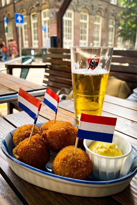 Bitterballen with a Dutch Flag Amsterdam Street Food, Dutch Aesthetic, Food In Amsterdam, Amsterdam With Kids, Netherlands Travel Destinations, Netherlands Trip, Amsterdam Restaurants, Amsterdam Aesthetic, Netherlands Food