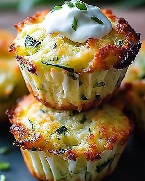 Savory Parmesan Zucchini Potato Muffins with a Golden Crispy Top Ingredients: 2 medium zucchinis, grated 2 medium potatoes, grated 1 small onion, finely chopped 2 cloves garlic, minced 1/2 cup all-purpose flour 1/2 cup grated Parmesan cheese 2 large eggs, lightly beaten 1 teaspoon baking powder Salt and pepper, to taste 1/4 cup vegetable oil Sour cream and chopped chives, for garnish Directions: Prepare the Muffins: Preheat your oven to 375°F (190°C). Grease or line a 12-cup muffin tin. Pl... Unique Chili Recipes, Chili Recipe Healthy, Healthy Chili, Chili Relleno, Potato Muffins, Easy Chili, Parmesan Zucchini, Chili Recipe Easy, Muffin Tin