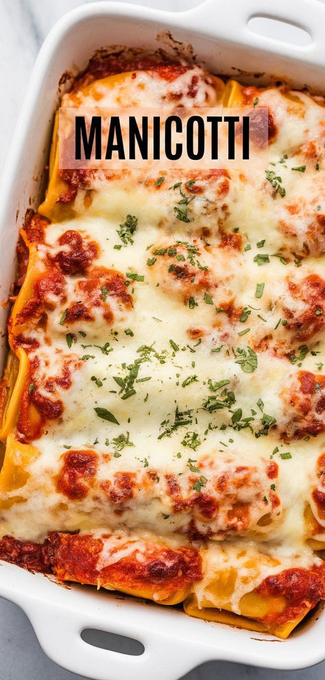 Deliciously stuffed with creamy ricotta and smothered in marinara, this classic Manicotti recipe is an easy weeknight favorite! Creamy Manicotti Recipe, Pasta Tubes Stuffed, Manicotti Recipes Stuffed, Stuffed Pasta Recipes Manicotti, Italian Manicotti Recipe, Stuff Manicotti Recipes, Easy Stuffed Manicotti Recipe, Stuffed Manicotti Recipe Ricotta, Stuffed Pasta Manicotti