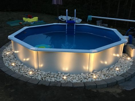 Bricks Around Above Ground Pool, Landscaping Lights Around Pool, Back Yard Above Ground Pool And Patio, Pool Edging Ideas Above Ground, River Rock Around Above Ground Pool, Renter Friendly Pool Ideas, Above Ground Pool Setup Ideas, Easy Above Ground Pool Landscape Ideas, Above Ground Pool Border