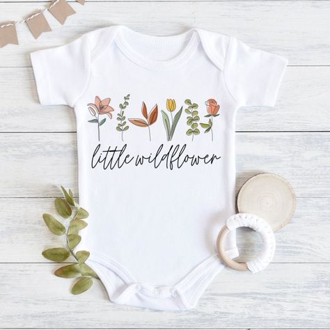 Little Wildflower Baby Bodysuit, Baby Girl Outfit, Boho Baby Girl Clothes, Flower Baby Outfit, Boho Baby Clothes, Baby Shower Gift Girl 💗 Welcome to The MintedWildflower Etsy Shop! DESCRIPTION: An adorable baby bodysuit with softness that is perfect for an infant's sensitive, smooth skin. Durable print will survive the very first adventures of your little explorer. Celebrate your bundle of sunshine with this sweet bodysuit. This adorable piece is the perfect light layer for a baby. This product Wildflower Baby Shower Gifts, Boho Baby Shower Flower, Wildflower Baby Shower Table Decorations, Baby Girl Boho Outfits, Wildflower On The Way, Wildflower Baby Girl Shower Ideas, Baby In Bloom Wildflower Shower Ideas, Baby Shower Ideas Wildflower, Wild Flowers Baby Shower Ideas