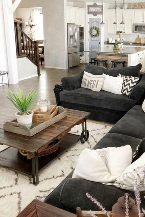 neutral gray farmhouse living room / den in an open floorplan layout design #cozylivingroom Gray Farmhouse Living Room, Grey Farmhouse Living Room, Cozy Grey Living Room, Living Room Inspiration Grey, Cozy Neutral Living Room, Dark Grey Living Room, Open Floorplan, Farmhouse Living Room Furniture, Storage Furniture Living Room