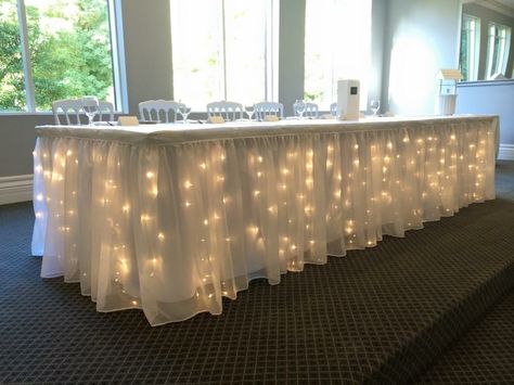 Wedding Head Table Tulle And Lights, Fairy Lights Party Decor, Lights Under Tablecloth, Fairy Light Table Decor, Fairy Lights Table Decor, Table Skirting Ideas Diy, Light Table Decorations, Sneakerhead Wedding, Snowball Decorations