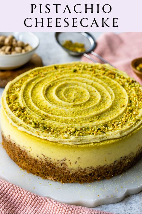 This Pistachio Cheesecake Recipe features a delicious Pistachio Graham Cracker Crust, with a creamy Pistachio Cheesecake filling, topped with Pistachio Ganache. It has the perfect balance between the nutty flavor and a rich and creamy texture. Pistachio Nutella Cake, Baked Cheesecake Decoration, Flavors Of Cheesecake, Stanley Tucci Pistachio Cheesecake, Pistachio Christmas Cake, Cheesecake Decorations Ideas, Cake With Pistachio Cream, Pistachio Cream Cheesecake, Cheesecake Recipes Pistachio