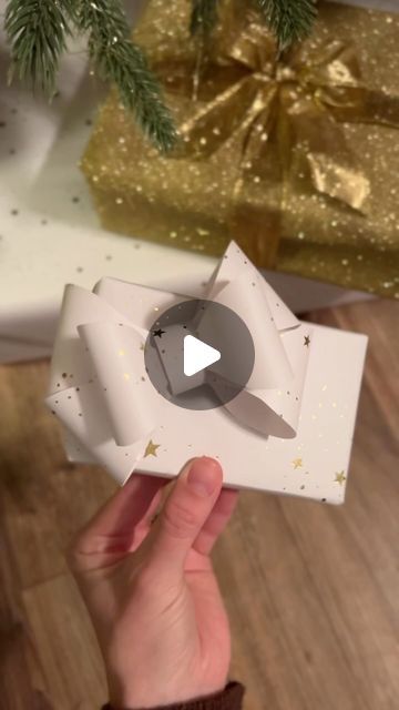 Morgan Renfro on Instagram: "Somehow i only had enough gold ribbon to make 1 bow on 1 present 🥲 so i did a fun little monochromatic bow moment with the same paper i used to wrap the gift! #paperbow #giftbowtutorial #diypaperbow #howtowrapapresent #wrappingpaperbow #bow" Diy Gift Bow Ribbon Tutorials, Wrapping Paper Bow, Gift Bow Tutorial, Bows For Presents, Wrapping Hacks, Diy Gift Bow, Wrapping Paper Bows, Tie Ideas, Wrapping Techniques