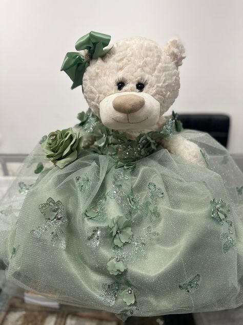 Quinceañera/Sweet 16  teddybear in a handmade Sage dress. "Mis XV años or Sweet 16" engraved on teddies foot.  This is a made to order product.  Can be made in any other color upon request. Sage Green Quinceanera Teddy Bear, Quince Teddy Bear Green, Sage Green Quinceanera Bear, Sage Green Quince Doll, Sage Quinceanera Decorations, Sage Green Quinceanera Ideas, Light Green Sweet 16 Theme, Sage Green Chambelan Outfits, Sage Sweet 16