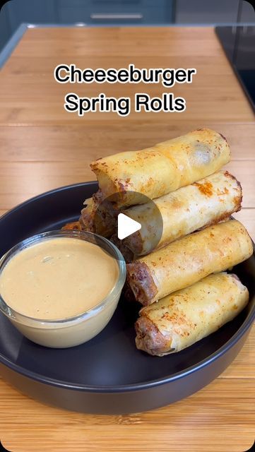 Erik DiMarucut on Instagram: "Cheeseburger spring rolls are a fun fusion dish combining the flavors of a classic cheeseburger with the crispy, handheld convenience of a spring roll. Typically, they contain ground beef, onions, cheese, and sometimes pickles, all wrapped in a spring roll wrapper and deep-fried until golden brown. They’re often served with dipping sauces like ketchup, mustard, or a special burger sauce.

Ingredients:
1 lbs ground beef 
1/2 pack of bacon 
1 medium onion - minced 
4 cloves garlic - minced 
1 tsp onion powder 
1 tsp salt 
1 tap ground pepper 
1/2 cup grated cheddar cheese 
1 Pack of American cheese 
1 Pack of egg roll/spring roll wrapper
4 cups oil for frying 

For dipping sauce:
3/4 cup mayo 
1/2 cup ketchup 
1/4 cup mustard 
1 pickle - diced 
1 tbsp pickle jui Burger Spring Rolls, Cheese Burger Spring Rolls, Recipes Using Spring Roll Wrappers, Cheese Burger Egg Rolls Recipe, Cheeseburger Spring Rolls, Spring Roll Wraps, Classic Cheeseburger, Spring Roll Wrappers, Fusion Dishes