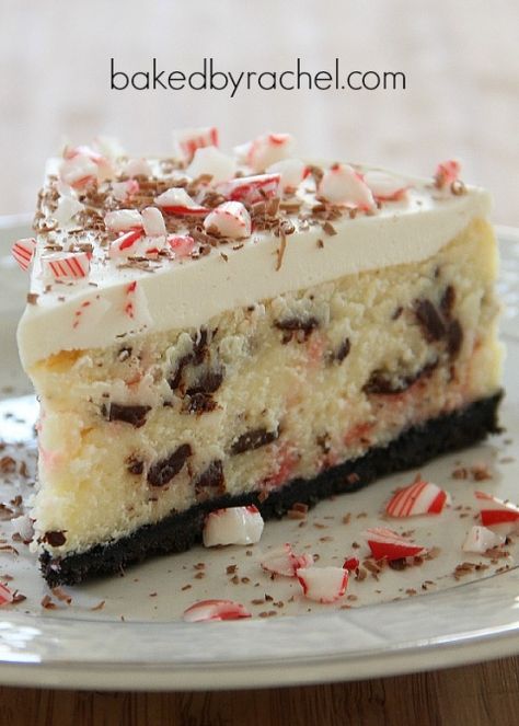 White Chocolate Peppermint Bark Cheesecake Recipe from bakedbyrachel.com Peppermint Bark Cheesecake Recipe, White Chocolate Peppermint Cheesecake, Peppermint Bark Cheesecake, White Chocolate Peppermint Bark, Festive Holiday Desserts, Peppermint Recipes, Chocolate Peppermint Bark, White Chocolate Peppermint, Peppermint Cheesecake