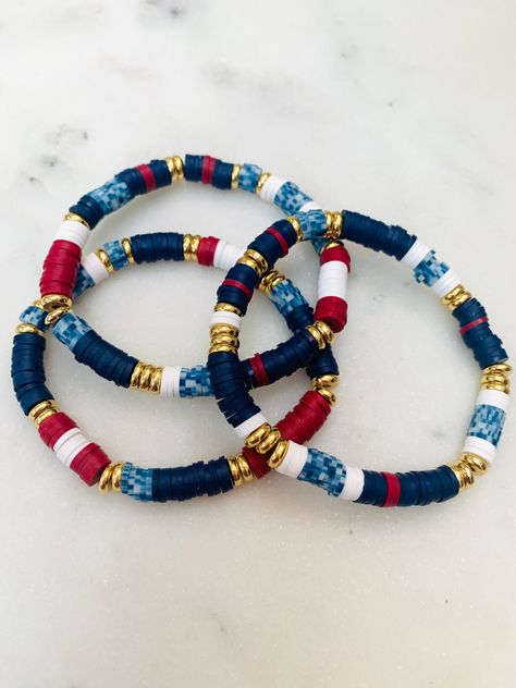 A mix of red, white and blue hieshi and gold accent non-tarnish beads. Wear this set to celebrate summer or for a day cruising the seas. Additional customization available upon request.  💟Please indicate the desired sizing within the customization section. Sizing length is as follows:  Women's small: 6.5 inches Women's medium: 7 inches Women's large: 7.5 inches Women's XL: 8 inches 💟Listing includes 3 bracelets. Any images shown with more bracelets is to be used as an example of how they can b Man Clay Bead Bracelet, Navy Clay Bead Bracelet, 4th Of July Bracelets Diy, Western Bracelets Clay Beads, Heishi Bracelet Ideas, Bracelets Heishi, Heishi Jewelry, Heishi Bracelets, Clay Bracelets