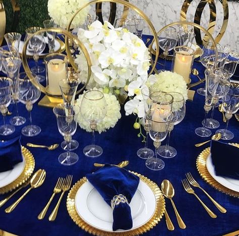 Navy and gold wedding reception Navy Blue And Gold Place Setting, Royal Blue And Gold Wedding Centerpieces, Navy And Gold Party Theme, Navy And Gold Wedding Reception, Sapphire Blue And Gold Wedding, Blue And Gold Quince Decorations, Royal Blue And Gold Party Decor, Navy Gold Centerpieces, Navy And Gold Gala Decor