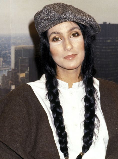 While visiting the The Stanley Siegel Show, Cher showed off her long braids under a cute newsboy cap. Super Blonde Hair, Cher Hair, Long Natural Curls, Long Layers With Bangs, How To Look Attractive, Cher Photos, Noomi Rapace, Hair Evolution, Professional Portrait