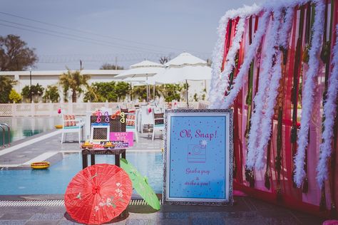 Trending and fun Photobooth ideas for Indian Weddings | Poolside photo booth | Photobooth props | Indian Wedding decor | Colorful parasols | Photobooth backdrop | Credits: Kunal Khanna | Every Indian bride’s Fav. Wedding E-magazine to read. Here for any marriage advice you need | www.wittyvows.com shares things no one tells brides, covers real weddings, ideas, inspirations, design trends and the right vendors, candid photographers etc. Indian Decoration, Photobooth Ideas, 90s Fashion Outfits Hip Hop Party, Mehendi Ceremony, Indian Marriage, Earrings Sets, Wedding Mandap, Indian Wedding Photos, Wedding Photo Booth