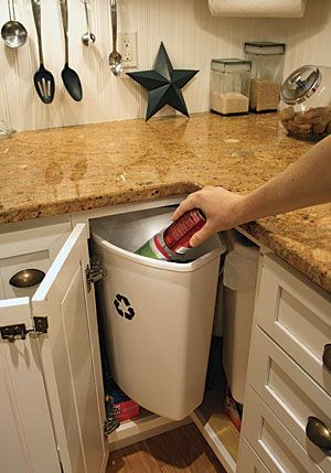 Refuse rotation. The triangular bins of the KV recycling center rotate into the corner-cabinet opening, clearing the countertop enough to insert whatever it is you need to throw away. Photo by: Debra Judge Silber Blind Corner Cabinet Solutions, Kitchen Corner Cabinet Ideas, Corner Cabinet Solutions, Kitchen Corner Storage, Blind Corner Cabinet, Trash Storage, Corner Kitchen Cabinet, Kitchen Addition, Kitchen Blinds