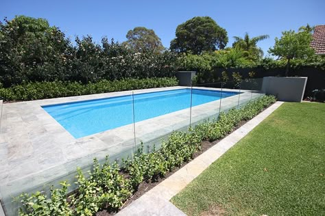 aqua-technics-siena-pool-gallery-1 Pool Fence Garden, Pool Hedge, Plants Around Pool Fence, Fenced Pool, Pool Garden Bed, Pool Hedge Fence, Pool Fence Landscaping, Raised Swimming Pool, Pool Surrounds