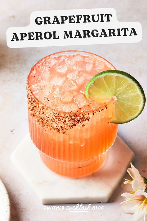 This grapefruit aperol margarita is a refreshing twist on the classic cocktail featuring blanco tequila, Italian bittersweet liqueur and fresh grapefruit juice sweetened with agave and rimmed with a mixture of salt and chili lime seasoning. Aperol Margarita Recipes, Tequila Aperol Cocktail, Aperol Margarita, Tequila And Lemonade, Tequila Based Cocktails, Grapefruit Martini, Italian Margarita, Grapefruit Vodka, Lime Seasoning