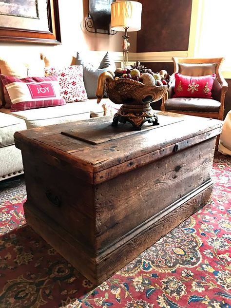 Antique wood trunk or chest used as a coffee table in a living area. Beautiful! Rustic farmhouse style! Chest Trunk Coffee Table, Chest For Coffee Table, Wood Trunk Coffee Table, Living Room Trunk, Rustic Living Room Coffee Tables, Antique Chest Coffee Table, Trunk For Coffee Table, Wood Trunk Ideas, Chest As Coffee Table