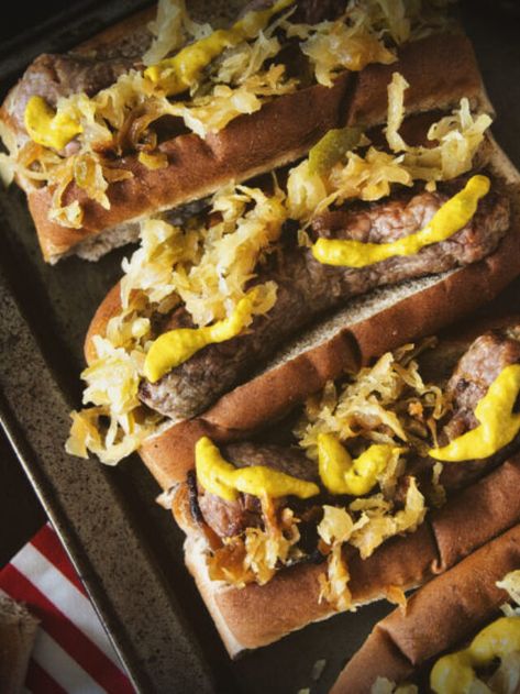 Spicy Mustard Brats with Sauerkraut Story - Girl Carnivore Brats With Sauerkraut, Brats On The Grill, Sour Kraut, Zucchini Fries Baked, Parmesan Crusted Zucchini, Grilled Brats, Bratwurst Sausage, German Sausage, Spicy Mustard