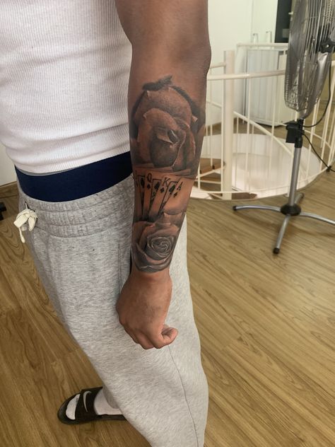 Roses & Card tattoo Rose And Cards Tattoo, Rose Made Of Cards Tattoo, Roses And Feathers Tattoo, Rose Leaf Tattoo, Men’s Rose Forearm Tattoos, Men’s Forearm Tattoo Ideas Rose, Rose Forearm Tattoo Men, Rose Forearm Tattoo, Cards Tattoo