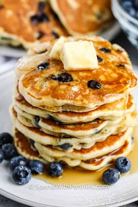 Blueberry pancakes are an easy and delicious weekend breakfast! Made with juicy fresh or frozen blueberries mixed into a fluffy pancake batter, cooked until golden, and topped with butter and syrup! #blueberrypancakes #pancakes #breakfast #spendwithpennies Homemade Blueberry Pancakes, Blueberry Crepes, Fluffy Blueberry Pancakes, Homemade Pancake Mix, Yummy Pancake Recipe, Blueberry Pancakes Recipe, Berry Pancakes, Pancakes Breakfast, Pancakes From Scratch