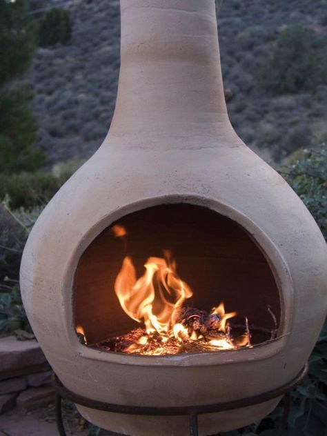 Browse options for a chiminea clay outdoor fireplace, plus browse helpful pictures from HGTV. Clay Chiminea, Helpful Pictures, Clay Fire Pit, Chiminea Fire Pit, Fire Pit Decor, Fire Pots, Outdoor Fireplace Designs, Hgtv Garden, Patio Fireplace