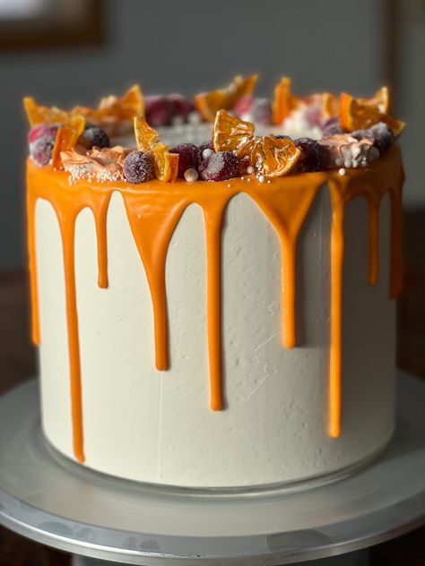 White cake, cranberry filling, and orange flavored SMBC Cake With Orange Decoration, Orange Cake Designs Birthday, Orange Frosted Cake, Orange And White Cake Design, 35th Birthday Cake, White Cake Orange Flowers, 35th Birthday Cakes, Cranberry Filling, 35th Birthday