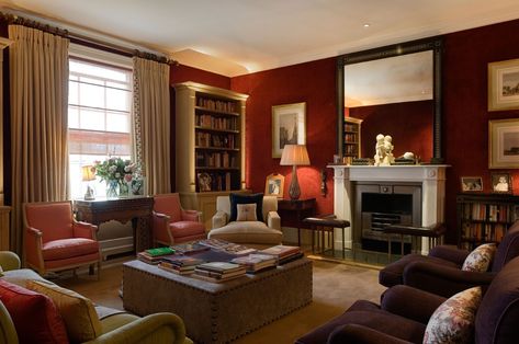 This study come home library, Georgian sitting room is a warm and inviting space. Deep red walls with plenty of comfy chairs and sofas create the perfect place to relax in the evening. How to get the look https://www.fabricsandpapers.com/ideas-advice/georgian-sitting-room-decor #CountryHouses #RuralLife #LuxuryHomes Red Living Room Walls, Todhunter Earle, London Living Room, Sitting Room Decor, Red Living, London Houses, Interior Design London, Country House Interior, Latest Interior Design