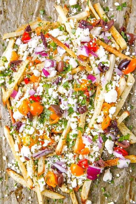 Feta cheese, red onion, tomatoes, olives, Mediterranean flavors loaded on from-scratch potato fries make these Greek Fries a favorite recipe. Loaded Fries Recipe, Greek Fries, Mediterranean Appetizers, Feta Cheese Recipes, Greek Dinners, Mediterranean Spices, 2024 Recipes, Loaded Fries, Baked Fries