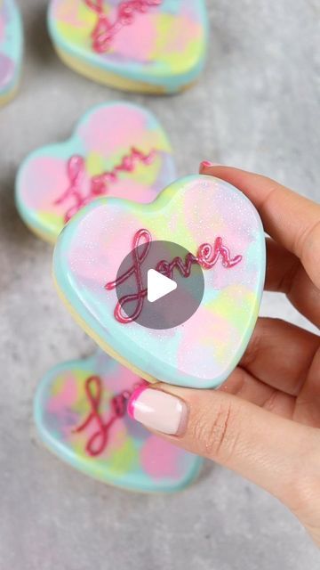 404K views · 9.4K likes | Liz Nicolaou on Instagram: "Lover Era Cookies 💕  100% inspired by the Taylor Swift Album Cover 🥰  No spread cookie dough recipe in my recipe highlights.  Tools used (including the heart mold) in my amazon storefront-linktree in bio  Dabber brushes from @sweet.stamp - use code LOVE10 for 10% off at sweetstamp.online   #heartcookies #chocolatecookies #valentinescookies #valentinesbaking #cookieart #lover #loverera #swiftie #loveisbakeable" Taylor Swift Macarons, Taylor Swift Treats, Taylor Swift Dessert Ideas, Taylor Swift Desserts, Taylor Swift Cookies Decorated, Taylor Swift Cupcakes, Taylor Swift Cookies, Swift Party, Cookie Dough Recipe