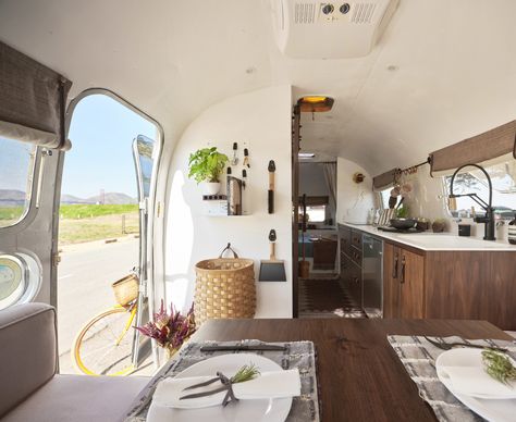 This Remodeled 1973 Airstream Is a Gorgeous Road-Trip Home—or Permanent Guest Room | Sunset Magazine Boho Airstream Interior, Airstream Interior Ideas, Airstream Excella 34 Remodel, Airstream Globetrotter Interior, Basecamp Airstream, Airstream Decor, Airstream With Bunkbeds, Airstream Basecamp Rei, Airstream Restoration