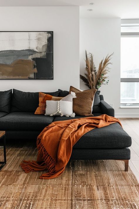 Living Room Designs Burnt Orange, Gray Burnt Orange Living Room, Orange And Black Interior Design, Industrial Mcm Living Room, Black Culture Living Room Ideas, Rust Orange Living Room Decor, Charcoal Sofa Living Room Ideas, Terracotta Grey Living Room, Black And Walnut Living Room