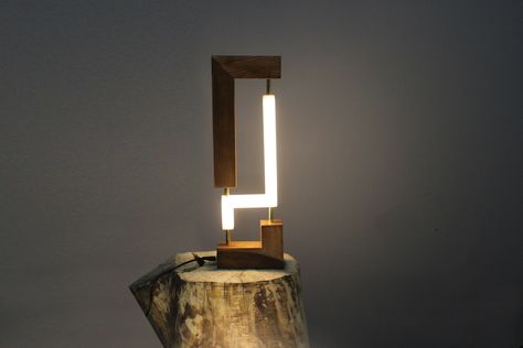 ---Special design Modern Table Lamp--- -Specially designed table lamp dazzles with its modern lines. -It can be used in many places such as living room, office study room and combines modern life with the magic of wood. -It is colored with natural walnut wood paint and is completely handmade. ---Product features--- -Premium wood body. -Real brass metal supports. -Powerful Daylight Led lighting. --Dimensions-- -Height: 38 cm -Width: 5 cm -Depth: 12 cm ---Box contents--- -Special design Modern Tab Lighting Dimensions, Office Study Room, Wooden Wall Lights, Exterior Light Fixtures, Lamp Desk, Wood Paint, Mood Lighting, Design Table, Natural Walnut