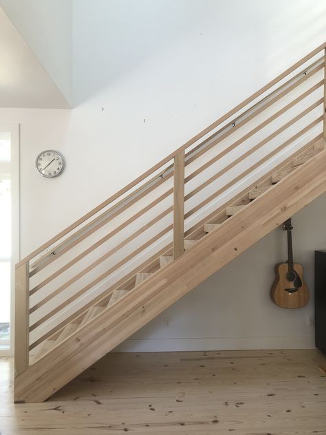 Horizontal stair railing on glulam staircase. All fir. Slats are 1x2 and handrail is 2x4. Super easy, inexpensive and beautiful scandi modern. 2x4 Stair Railing Ideas, Modern Oak Stair Railing, 2x4 Stair Railing, 2x4 Railing Ideas, Horizontal Railing Interior, Easy Diy Stair Railing, Inexpensive Stair Railing, Modern Wooden Stair Railing, Horizontal Banister