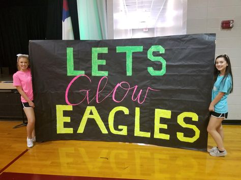 sign for the football players to run through at the beginning of the pep rally✨ *not pictured: the fog machine for dramatic effect Neon Themed Football Posters, Glow Pep Rally Signs, Field Signs For Football, Neon Run Through Signs Football, Neon Out Football Game Posters, Cheer Signs For Football Games, Neon Pep Rally Signs, Neon Theme Football Game Signs, Pep Club Themes