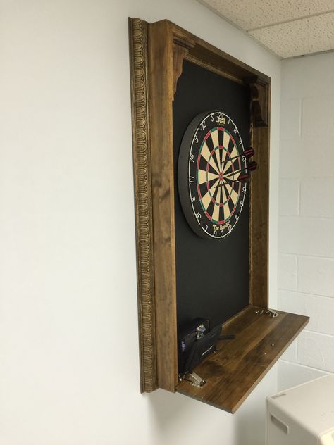 DIM (did it myself) dartboard cabinet--  homasote backboard catches stray darts, fold out shelf conceals cabinet contents, and provides a place to put your drink Dartboard Cabinet Diy, Dartboard Ideas, Dartboard Setup, Garage Brewery, Wood Dart Board, Cork Dartboard, Garage Playroom, Dart Board Wall, Dartboard Cabinet