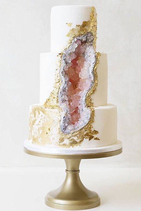 Move aside, naked cake; a hot new trend is about to take over weddings all around. We're seeing elegant wedding cake designs inspired by geode rocks rising on Instagram, and we can't stop staring. Classic white tiered cakes get a shock of vibrantly colored candy crystals that appear like quartz. The stunning results look straight out of National Geographic. Cake artist Rachael Teufel is leading this new craze and we can't wait to see more follow:  https://www.popsugar.com/food/Geode-Cakes-419705 Wedding Cake Designs Elegant, Torte Creative, Geode Cake Wedding, Geode Wedding, Big Wedding Cakes, Geode Cake, Torte Cupcake, Tiered Cake, Cake Trends